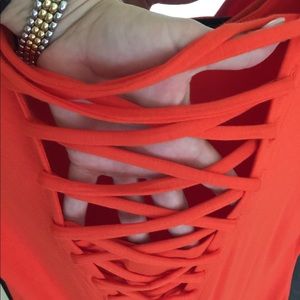 Red t-shirt dress with woven v neck to back.